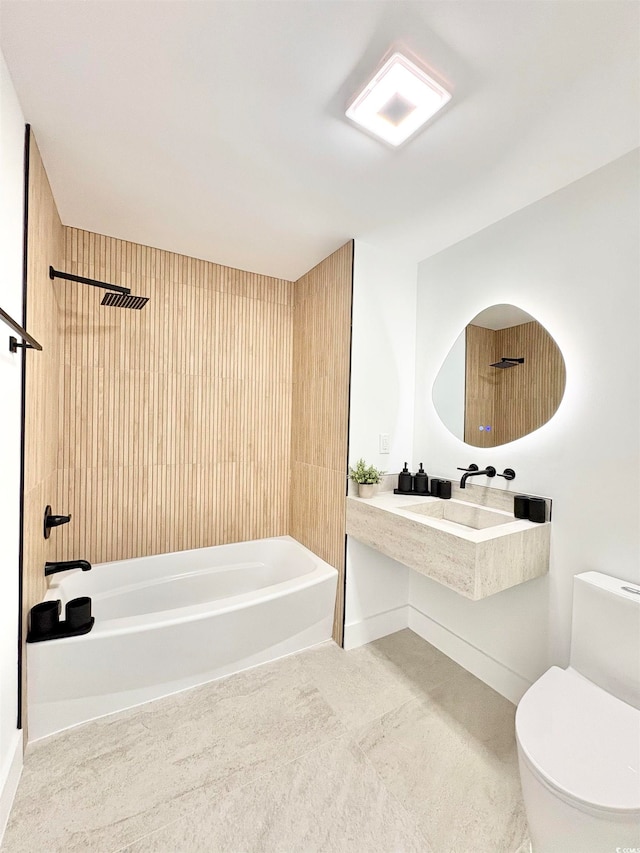 bathroom with wooden walls, toilet, and shower / bathing tub combination