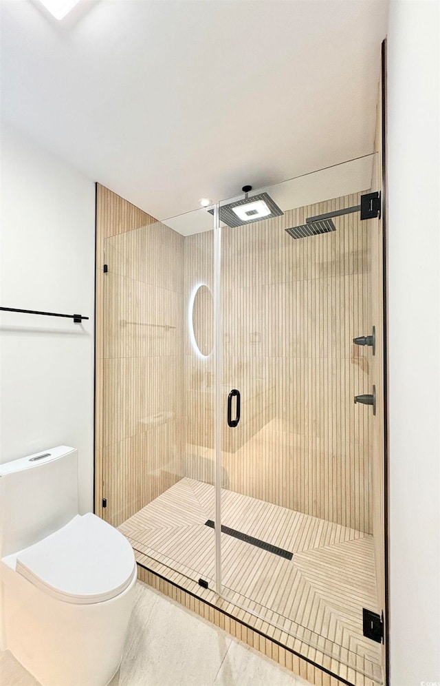 bathroom with walk in shower, toilet, and tile patterned flooring