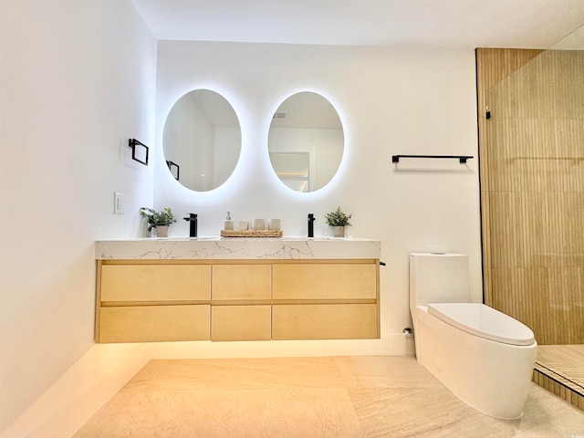 bathroom featuring toilet, a shower, and vanity