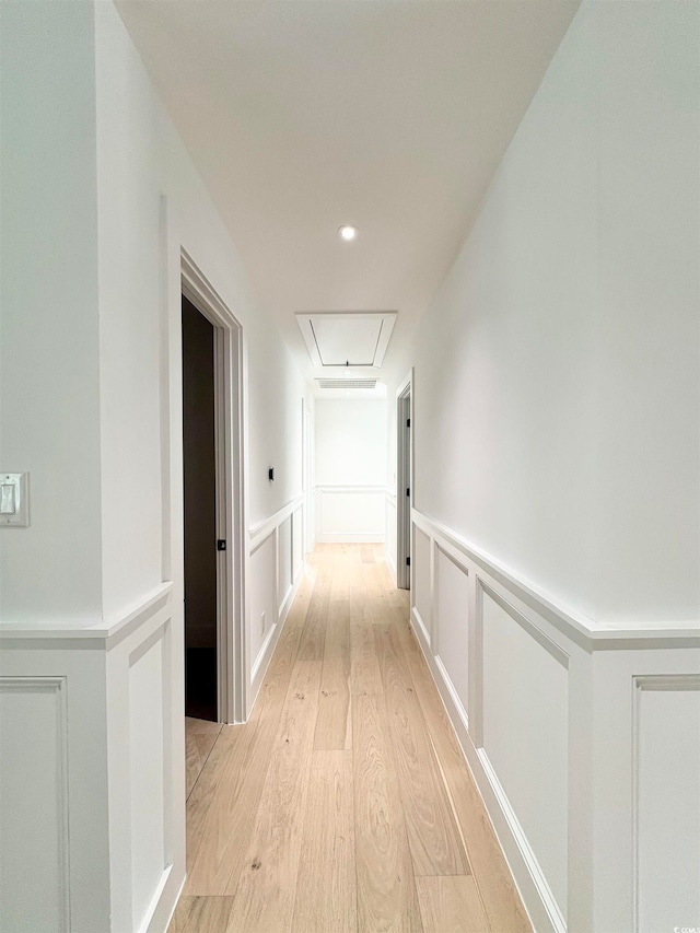 corridor with light wood-type flooring