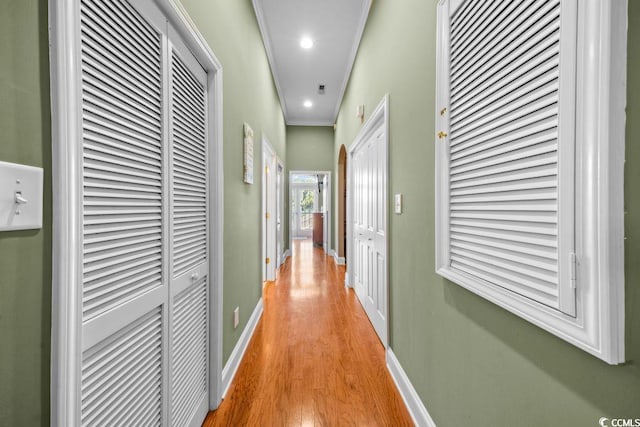 304 76th Ave N Unit D, Myrtle Beach, SC 29572 - hall featuring light wood-style floors, baseboards, a heating unit, crown molding, and recessed lighting