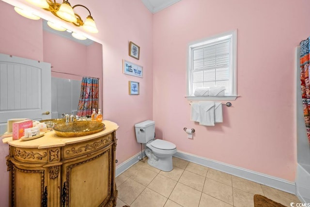 bathroom with tile patterned floors, a shower with curtain, vanity, and toilet