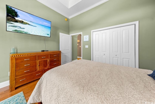 304 76th Ave N Unit D, Myrtle Beach, SC 29572 - bedroom featuring crown molding, a closet, baseboards, and wood finished floors