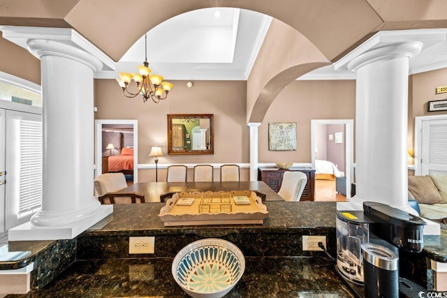 304 76th Ave N Unit D, Myrtle Beach, SC 29572 - dining area featuring ornate columns, arched walkways, ornamental molding, and a chandelier