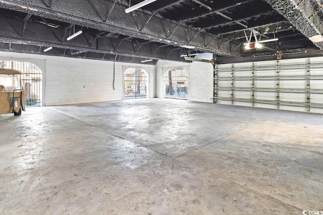 304 76th Ave N Unit D, Myrtle Beach, SC 29572 - garage with concrete block wall and a garage door opener