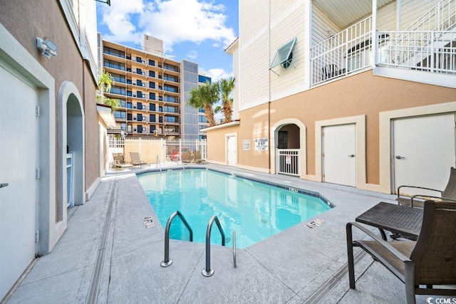 view of pool featuring a patio