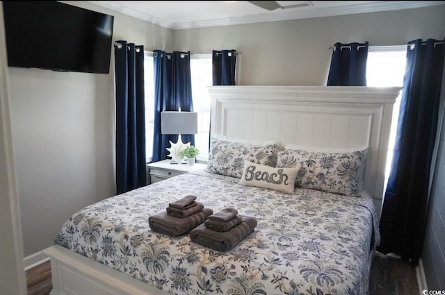 309 21st Ave N, North Myrtle Beach, SC 29582 - bedroom featuring multiple windows, ornamental molding, wood finished floors, and baseboards