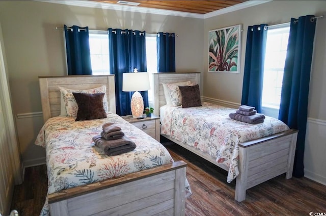 bedroom featuring dark wood-type flooring and crown molding