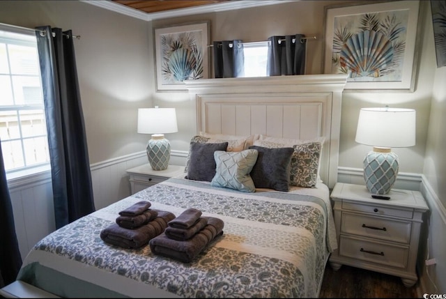 309 21st Ave N, North Myrtle Beach, SC 29582 - bedroom with crown molding, wainscoting, and multiple windows