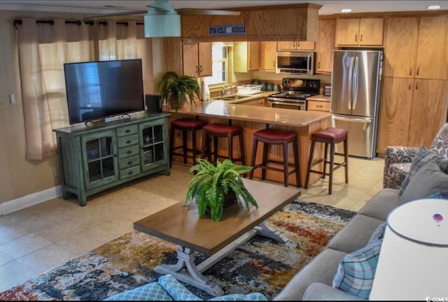 tiled living room featuring sink