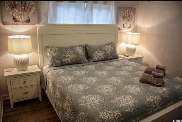 bedroom featuring dark hardwood / wood-style flooring