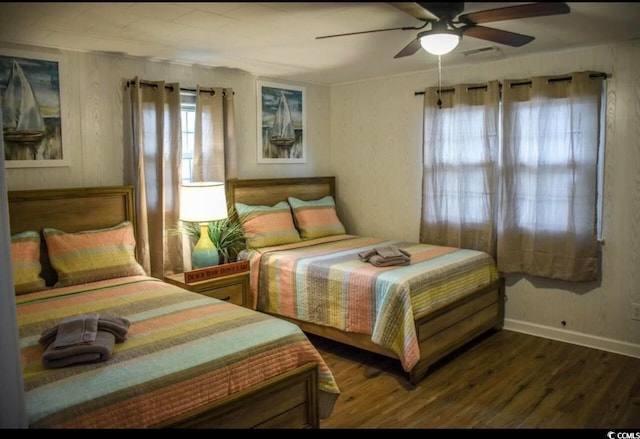 bedroom featuring wood-type flooring and ceiling fan