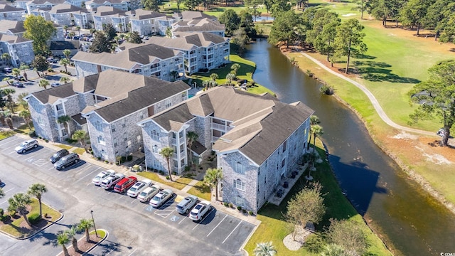 bird's eye view with a water view