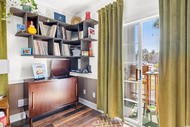 office featuring dark hardwood / wood-style floors and crown molding