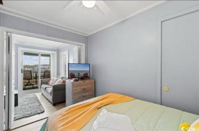 bedroom featuring ceiling fan and ornamental molding