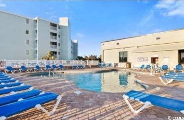 view of swimming pool featuring a patio area