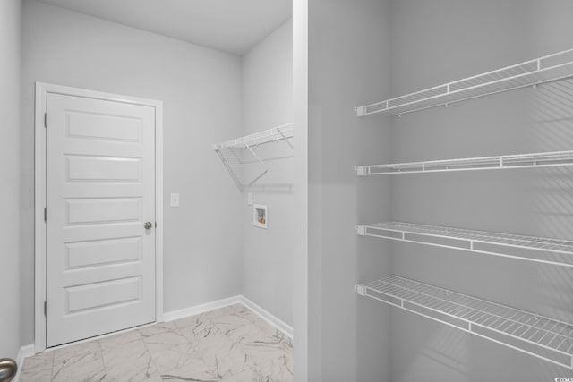 9746 Indigo Creek Blvd, Murrells Inlet, SC 29576 - laundry area with marble look tile flooring, washer hookup, and baseboards