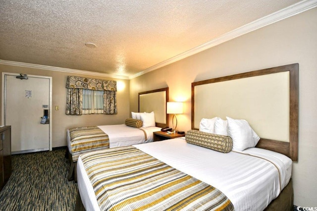 carpeted bedroom with ornamental molding and a textured ceiling