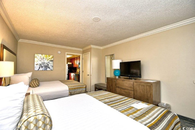 bedroom with black refrigerator, a textured ceiling, and ornamental molding