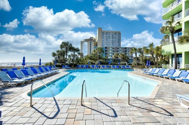 view of swimming pool with a patio area