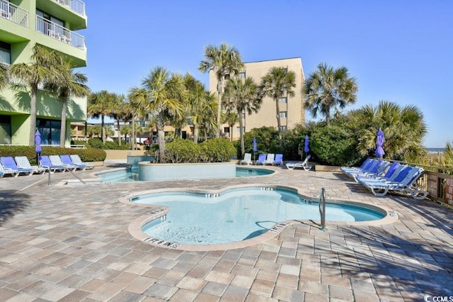 view of swimming pool with a patio area