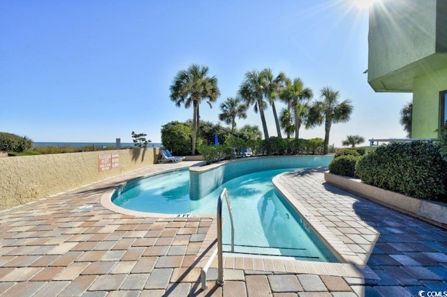 view of swimming pool featuring a patio area