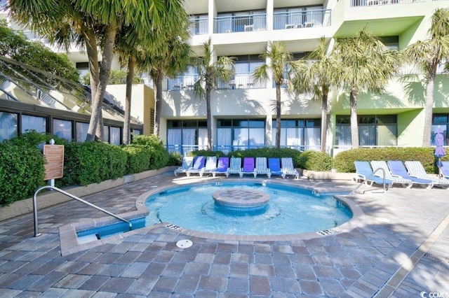 view of swimming pool featuring a patio