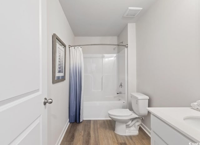 full bathroom featuring vanity, wood-type flooring, toilet, and shower / bathtub combination with curtain