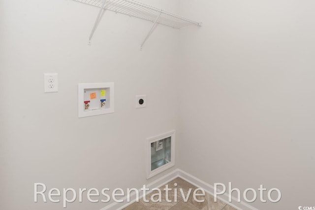 clothes washing area featuring hookup for a washing machine and electric dryer hookup