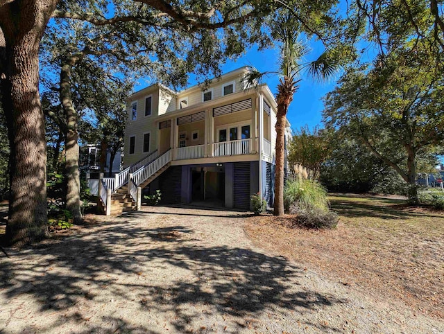 rear view of property featuring a porch