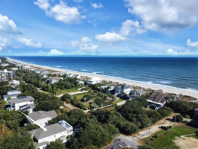 birds eye view of property featuring a view of the beach and a water view