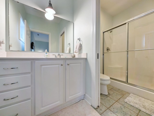 bathroom featuring walk in shower, tile patterned flooring, vanity, and toilet