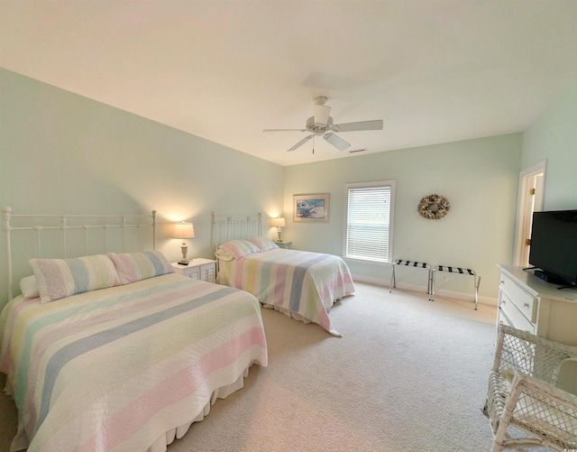 bedroom featuring ceiling fan and light colored carpet