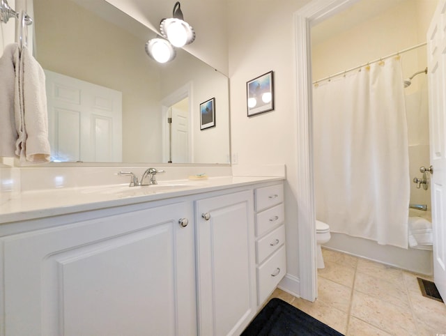 full bathroom with toilet, shower / bath combo, vanity, and tile patterned floors