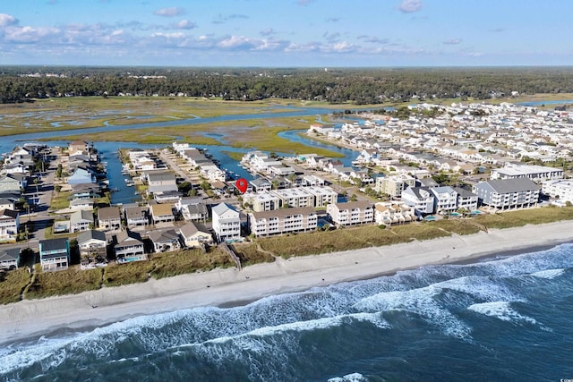 bird's eye view featuring a water view and a view of the beach