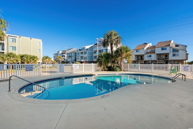 view of pool featuring a patio