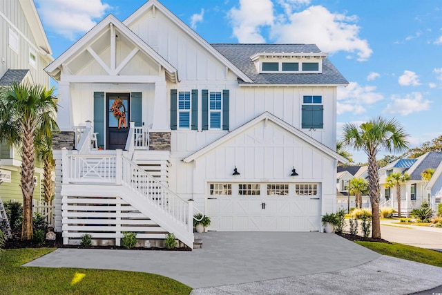 view of front of home featuring a porch and a garage