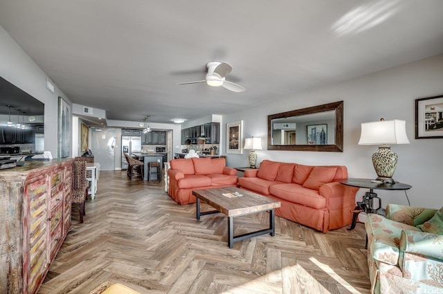 living room with parquet flooring and ceiling fan