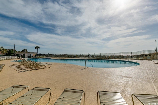 view of swimming pool featuring a patio