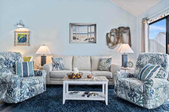 living room with vaulted ceiling and dark colored carpet