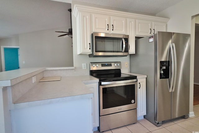 kitchen with white cabinetry, kitchen peninsula, ceiling fan, light tile patterned floors, and appliances with stainless steel finishes