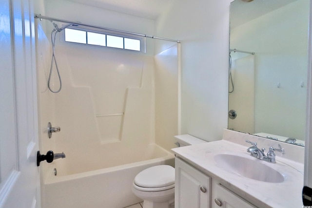 full bathroom featuring toilet, vanity, and tub / shower combination