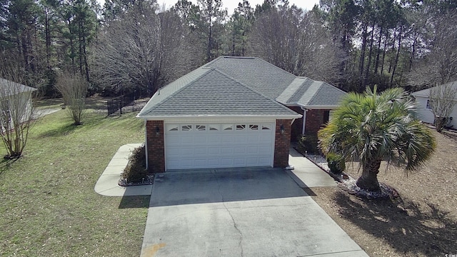 garage featuring a yard