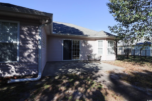 back of house with a patio