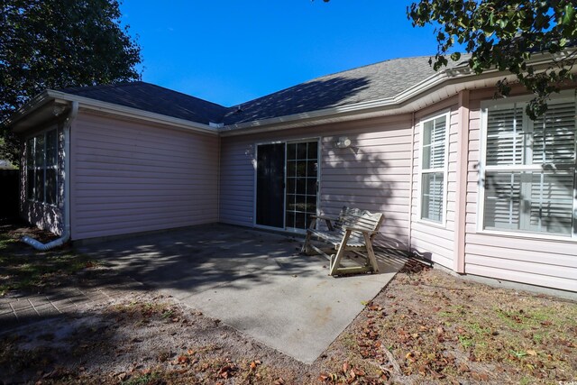 back of property featuring a patio area