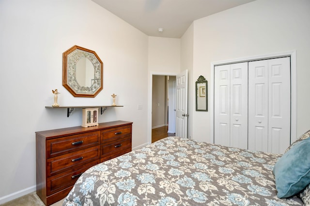 bedroom with a closet and light colored carpet