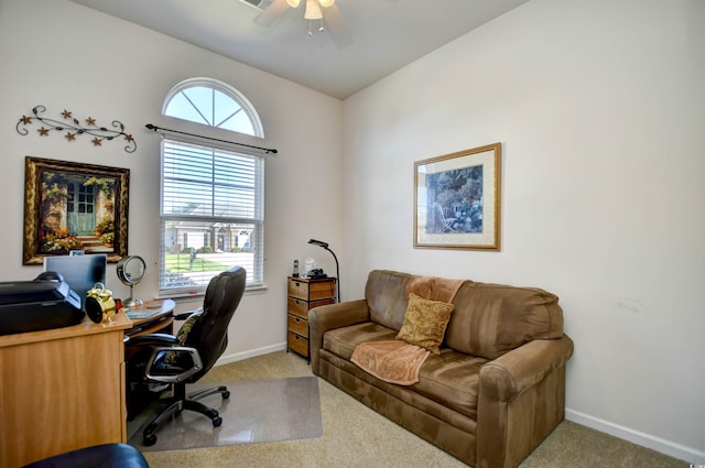 office space with ceiling fan, light colored carpet, and a healthy amount of sunlight