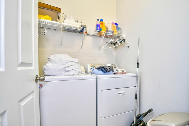 clothes washing area with washer and dryer