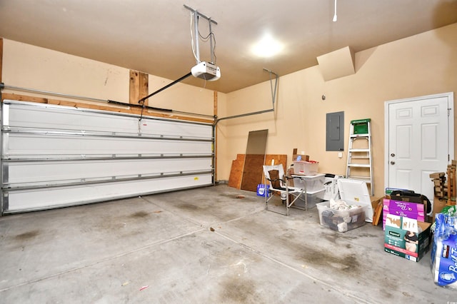 garage with electric panel and a garage door opener