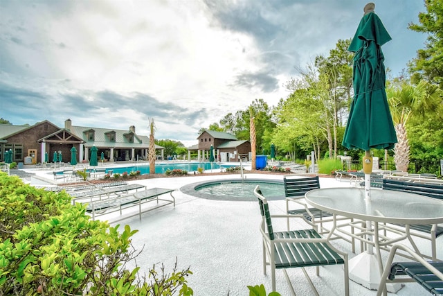 view of swimming pool with a patio area